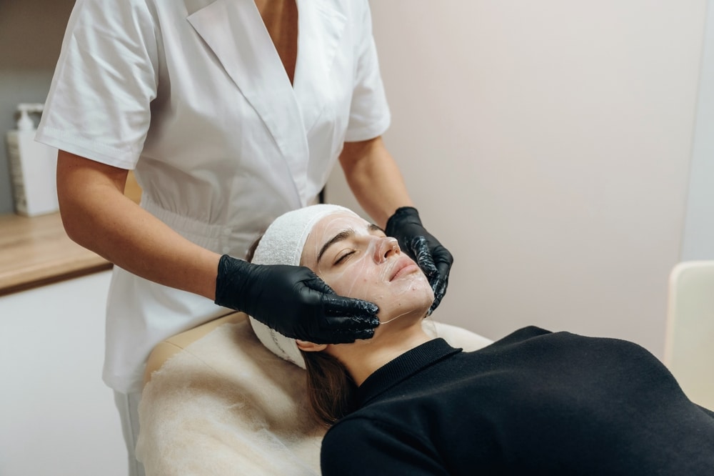 image of an aesthetic professional with a patient in the image