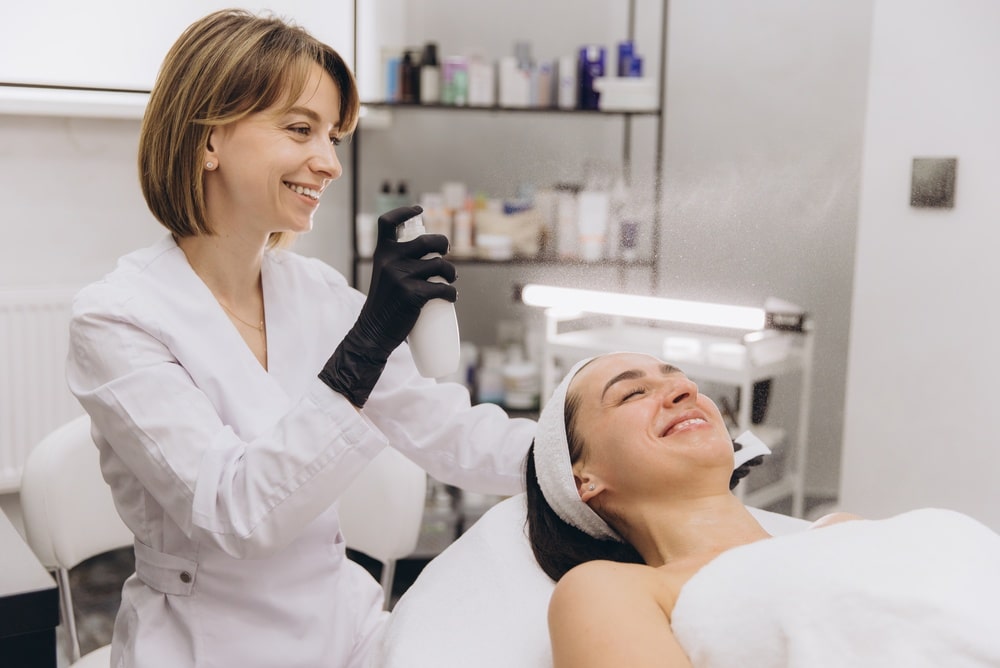 image of a woman holding a toner and another woman lying on a chair